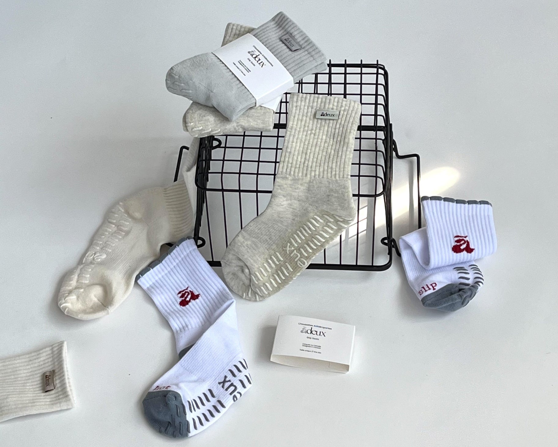Pilates grip socks on a black metal basket